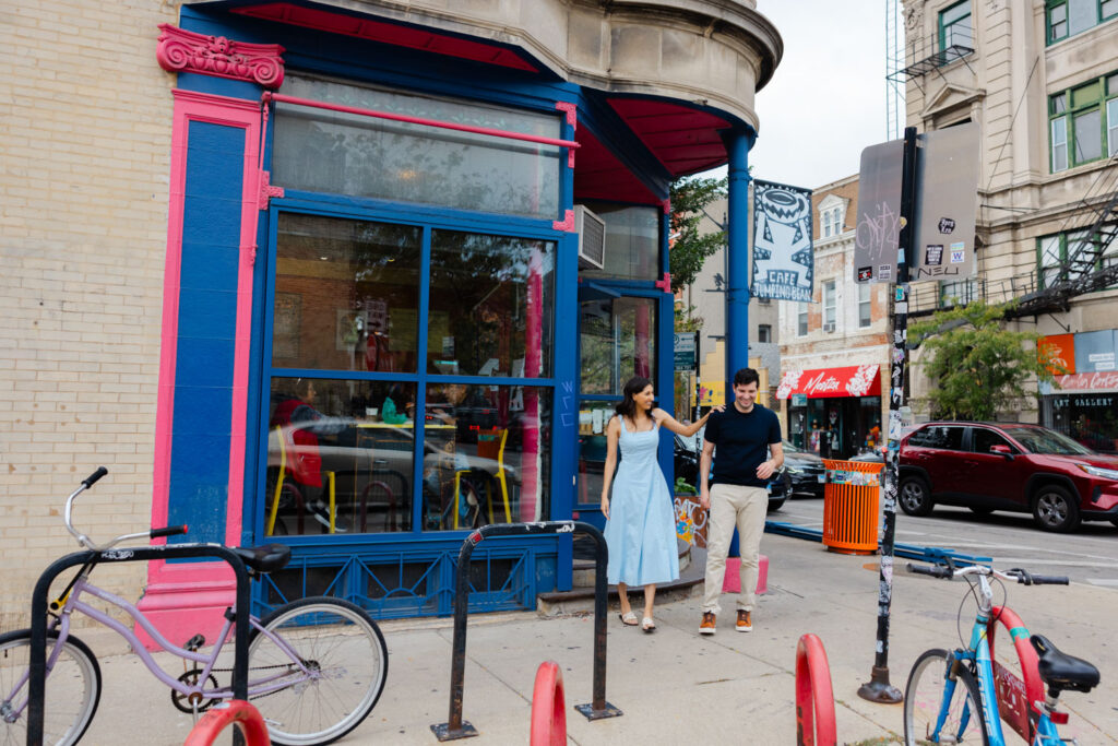 Couple laughing together outside colorful storefront in Pilsen Chicago