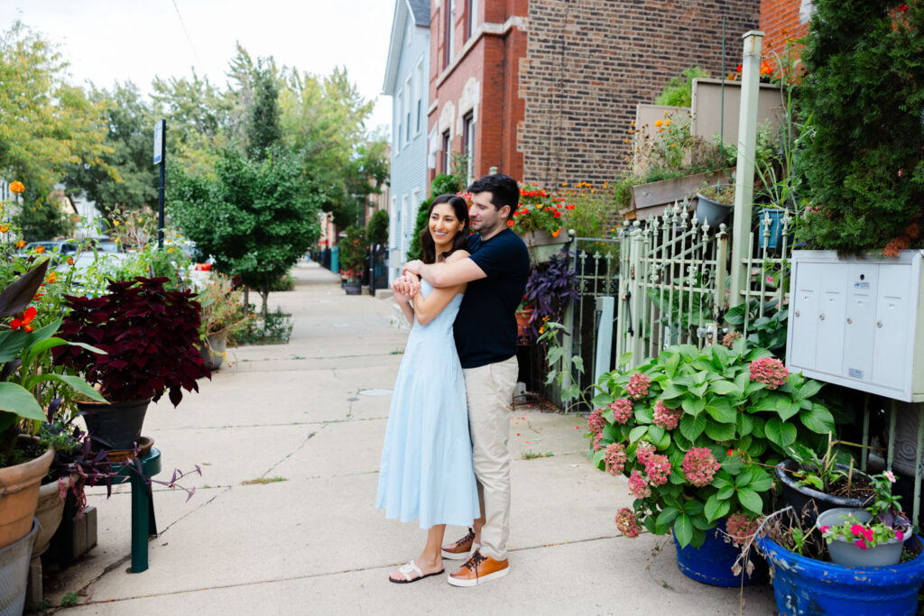 Couple hugging on a quiet residential street in Pilsen Chicago