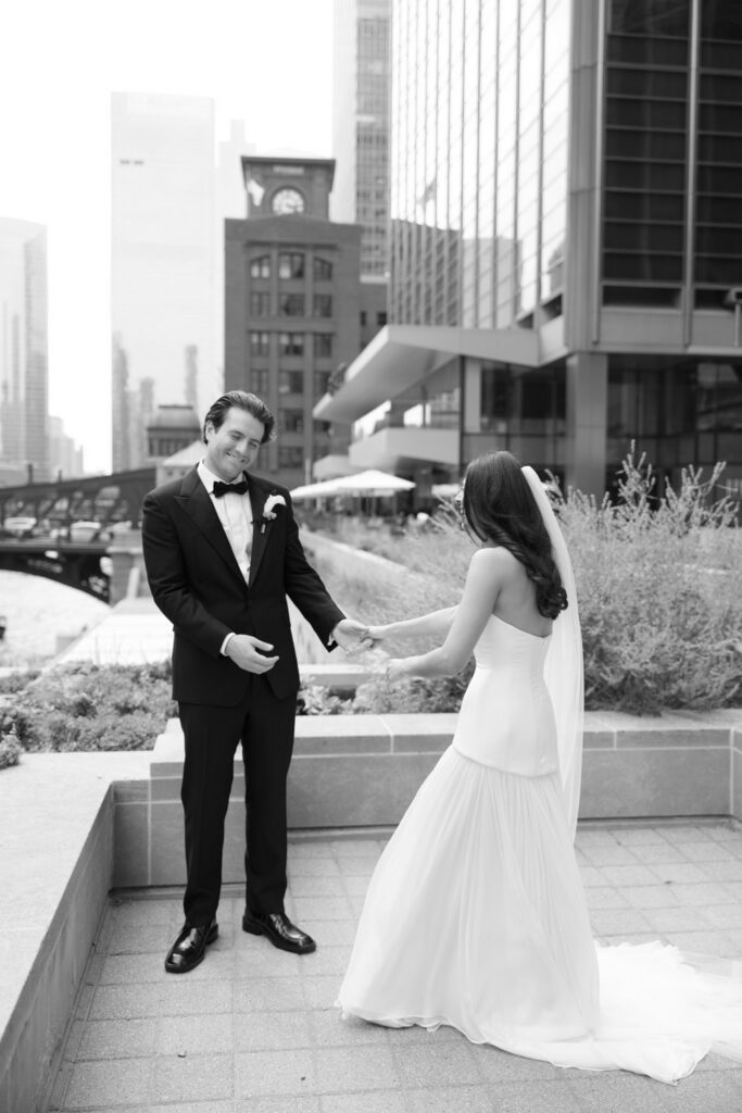 Bride and groom share a first look moment along the Chicago Riverwalk before their RPM Events wedding