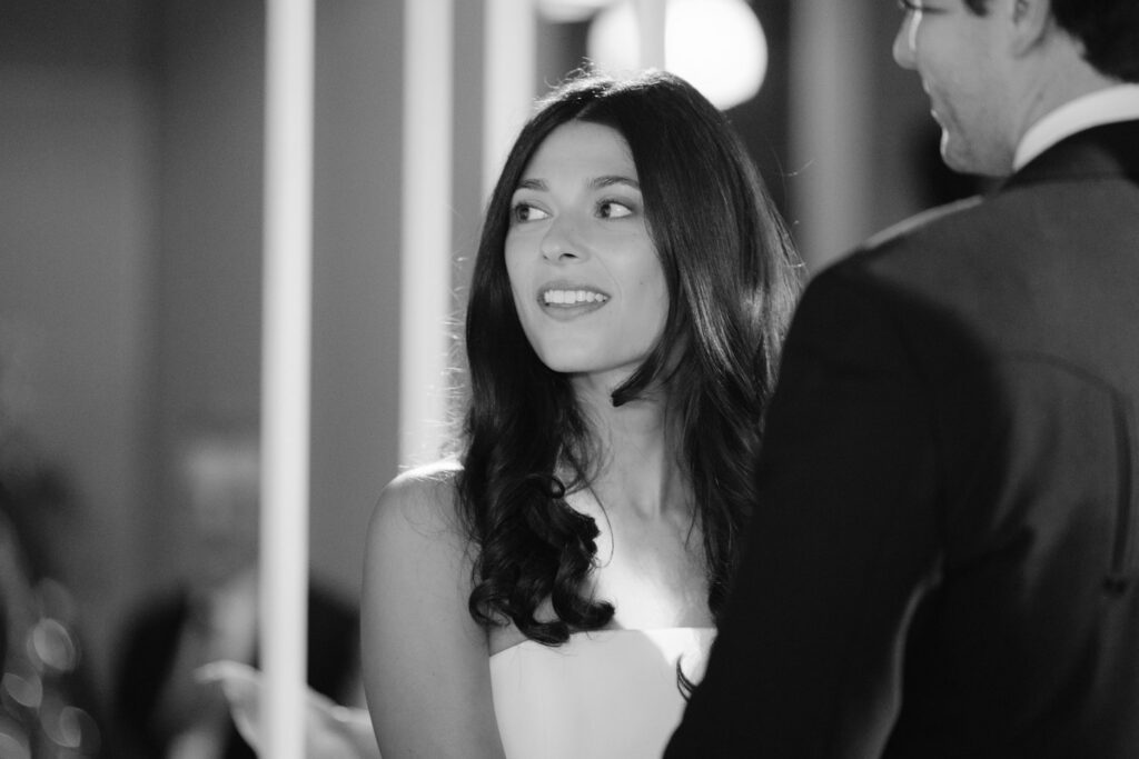Bride and groom standing beneath a floral chuppah during Jewish wedding at RPM Events Chicago.