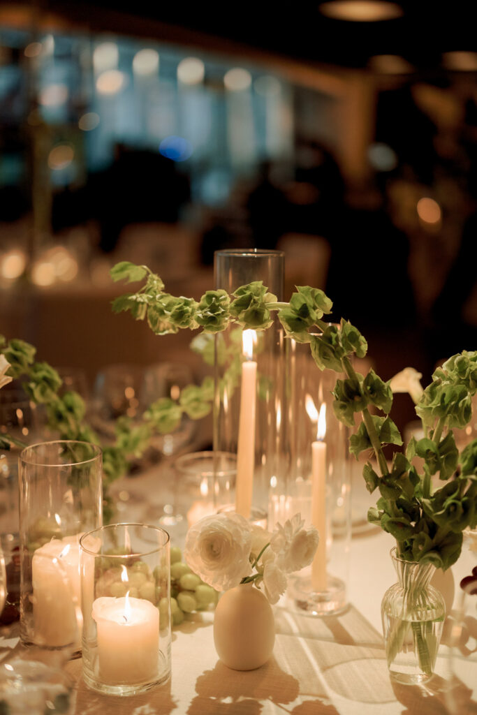 Close up of candlelight and floral arrangements at Chicago RPM Events wedding reception.