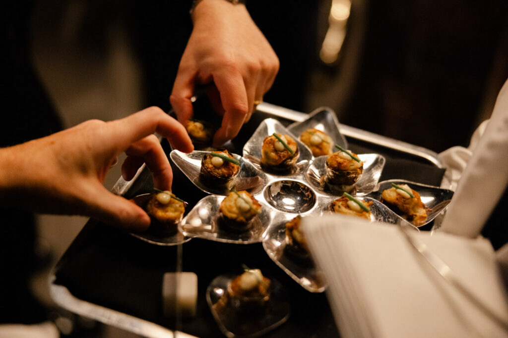 Wedding guests chatting and enjoying cocktails during cocktail hour at RPM Events in Chicago.