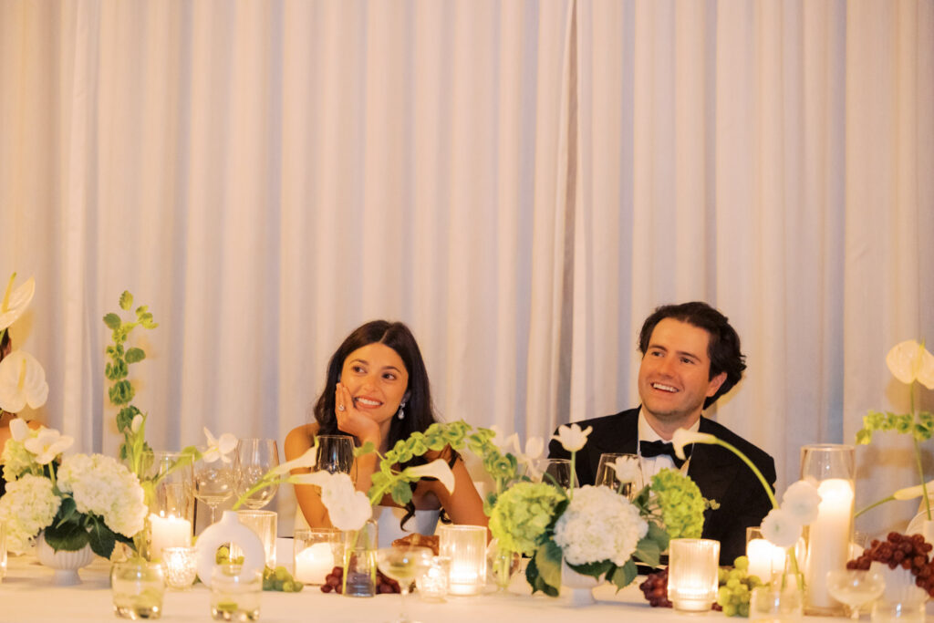 Bride and groom laughing during reception toasts at RPM Events wedding in Chicago.