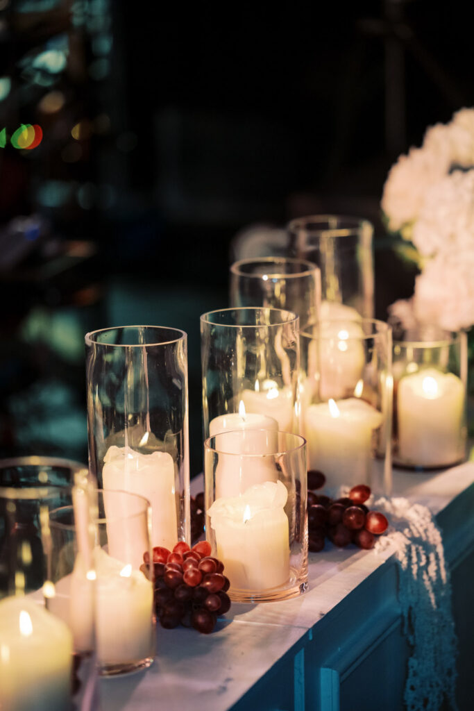 Close up of candlelight and floral arrangements at Chicago RPM Events wedding reception.