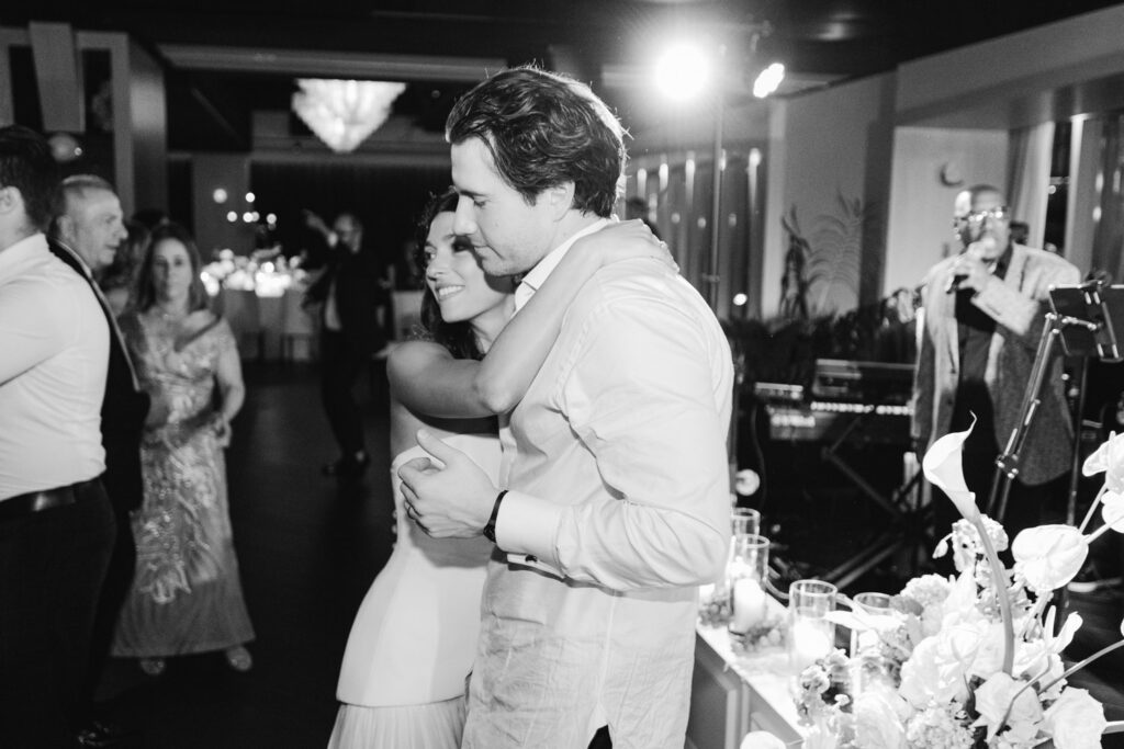 Guests dancing energetically during modern summer wedding reception in Chicago.