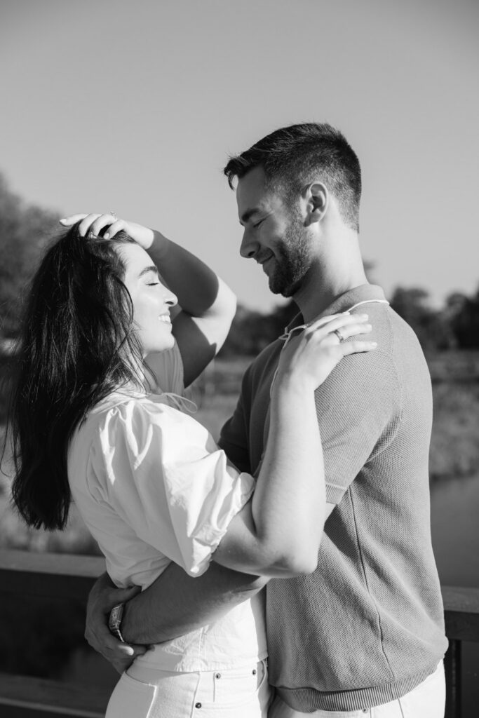 Couple embracing and smiling in soft natural light Lincoln Park Chicago engagement photo