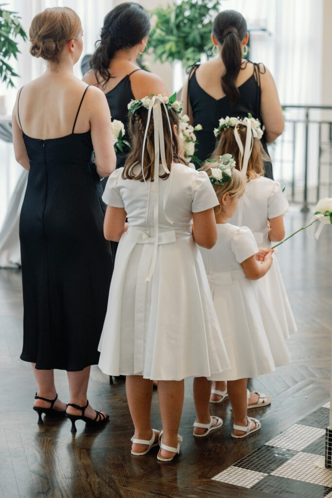 Wedding party standing during the ceremony at Mae District Chicago venue.