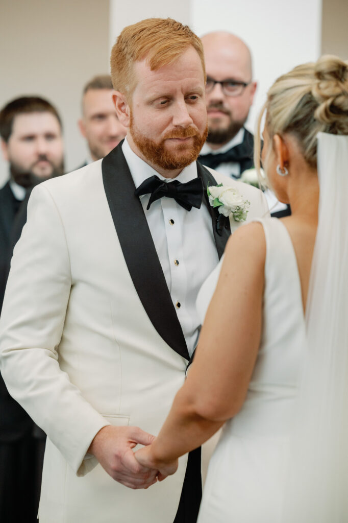 Bride and groom exchanging vows during their Mae District wedding ceremony in Chicago.