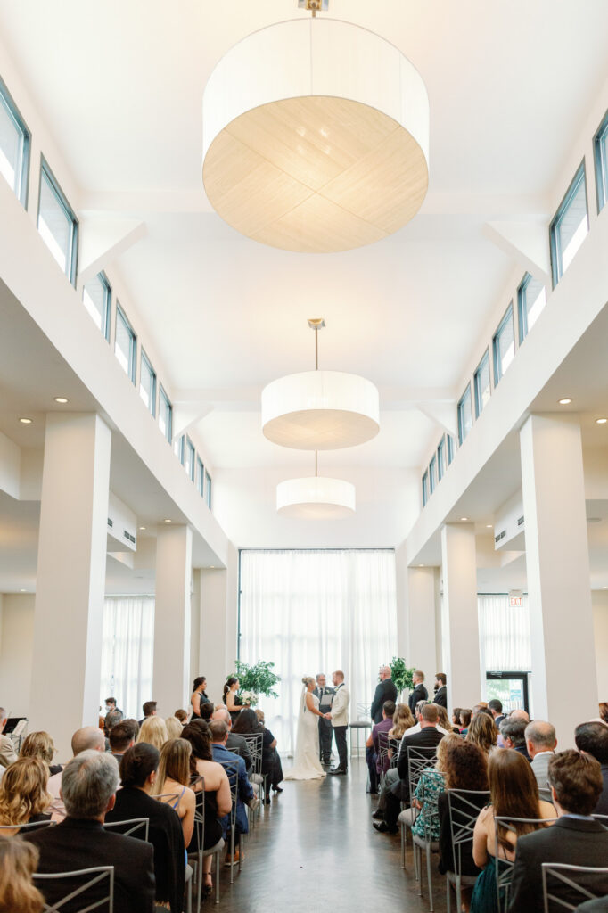 Guests seated and watching as the ceremony begins at Mae District in Chicago.