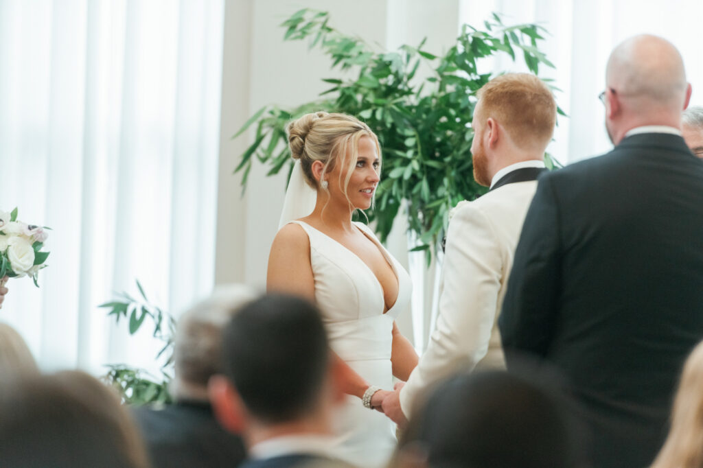 Bride and groom exchanging vows during their Mae District wedding ceremony in Chicago.