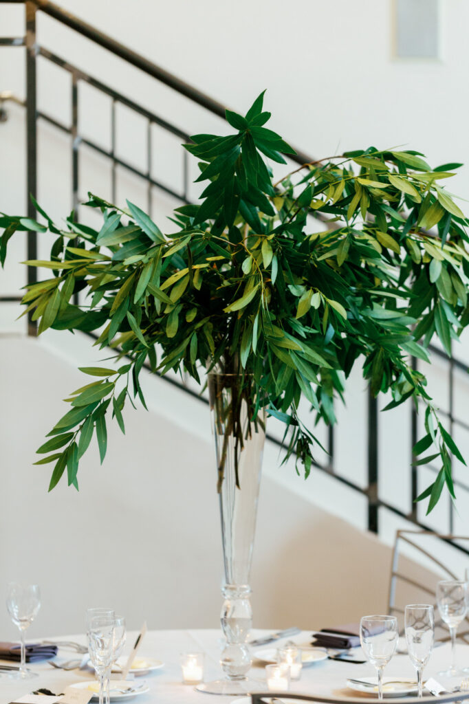 Close up of greenery floral arrangement used for reception decor at Mae District.