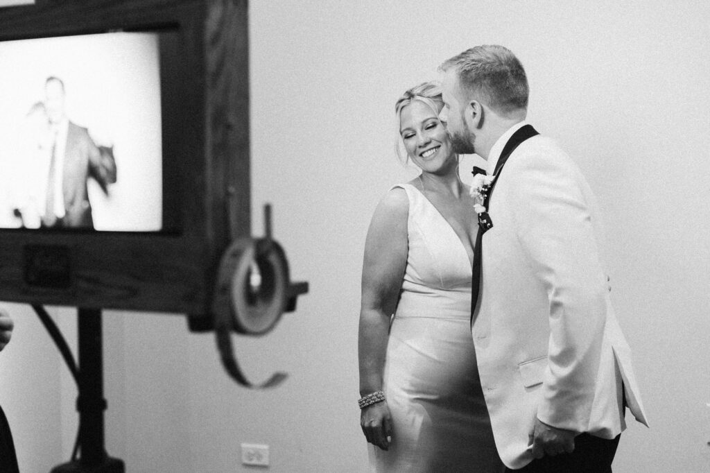 Bride and groom smiling together at the end of the night during their Mae District wedding in Chicago.