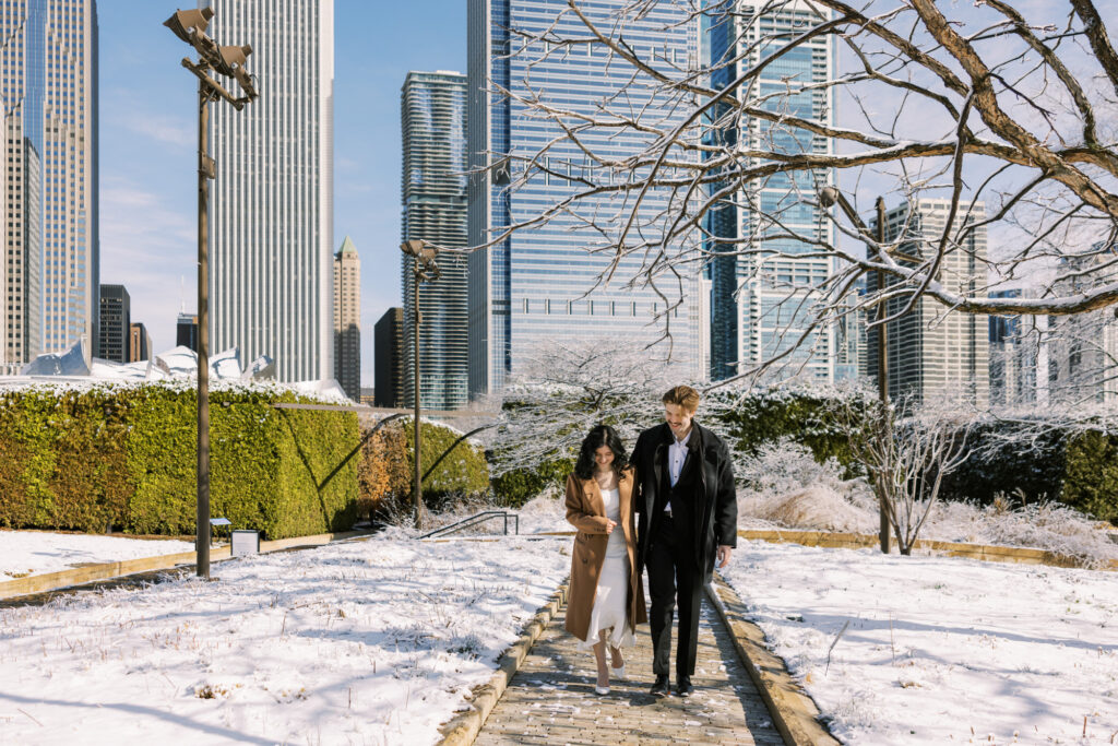 Chicago engagement photos in winter at Lurie Garden with skyline views