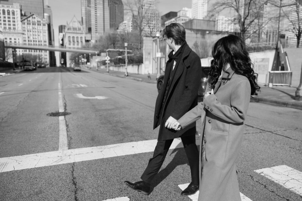 Chicago street engagement photos couple walking across downtown intersection