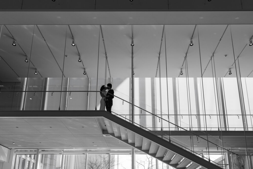 Art Institute Chicago staircase engagement photo with couple on upper level