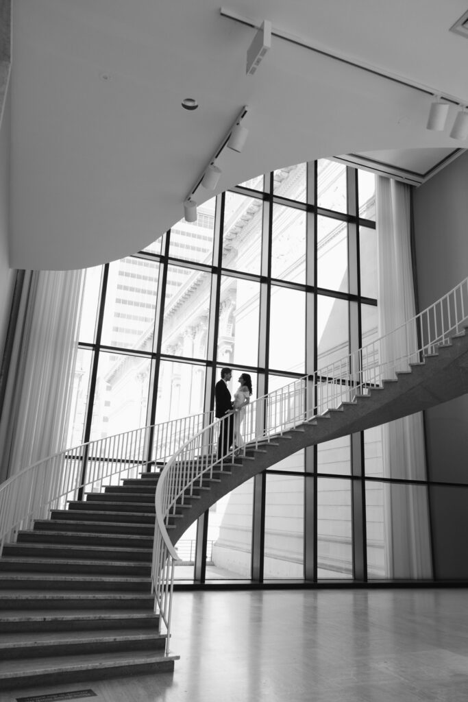 Art Institute Chicago staircase engagement photo with couple
