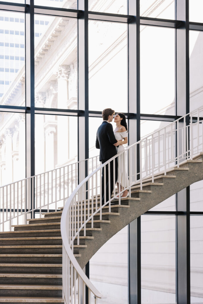 Art Institute Chicago staircase engagement photo with couple and curved railing