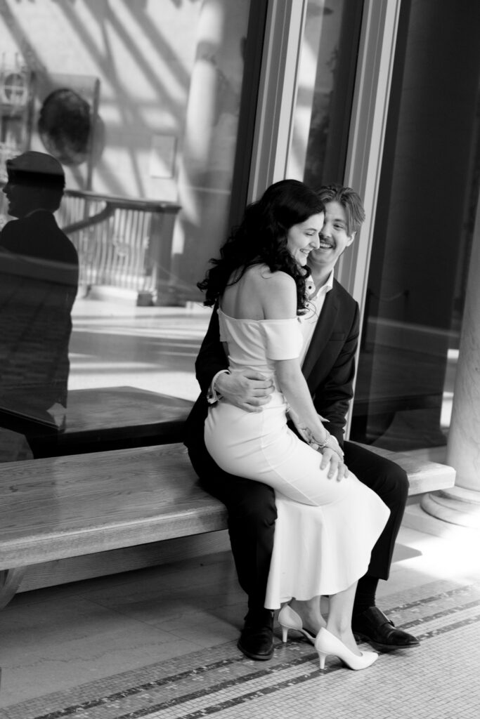 Art Institute Chicago engagement session couple sitting on bench
