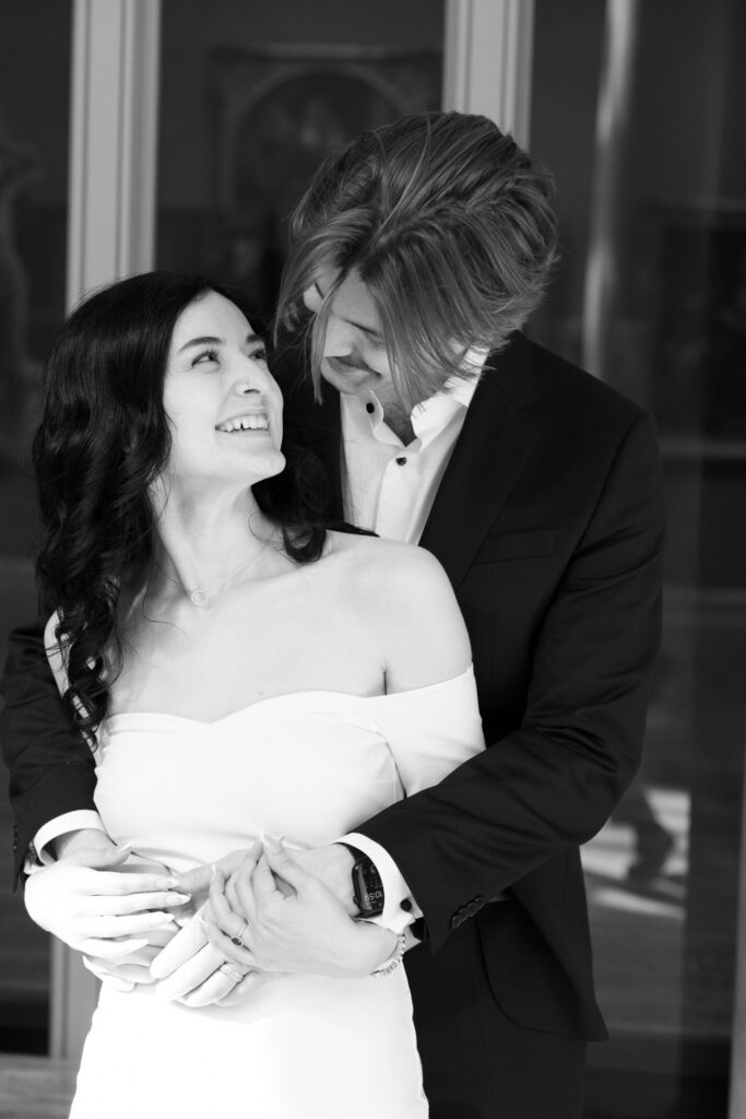 Natural light engagement portrait at Art Institute Chicago with couple smiling