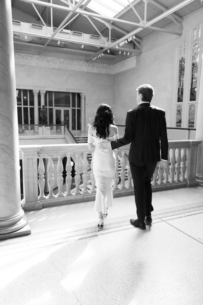 Art Institute Chicago engagement photos couple walking through historic gallery