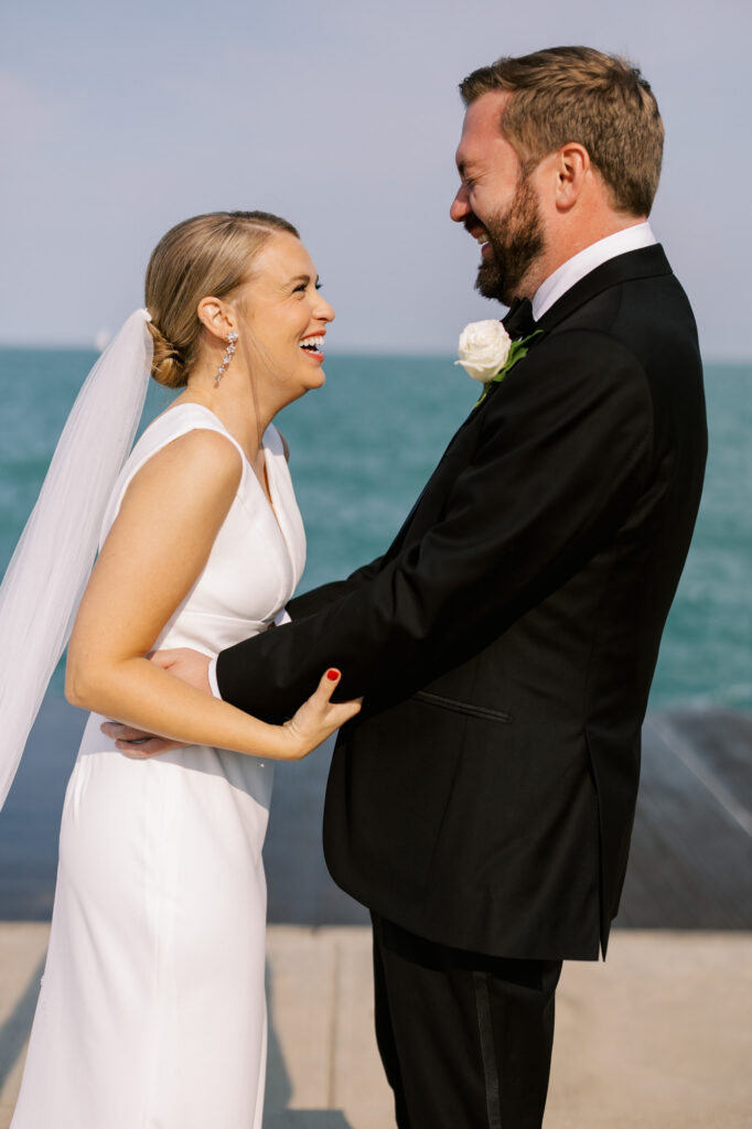 Bride And Groom Exchanging Vows By Lake Michigan