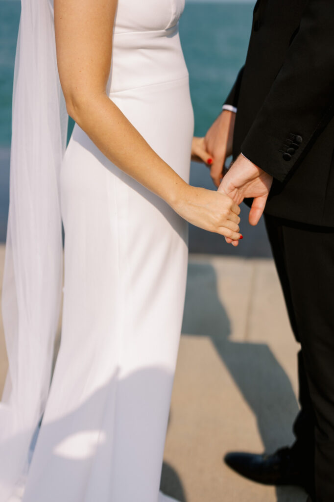 Bride And Groom Exchanging Vows By Lake Michigan