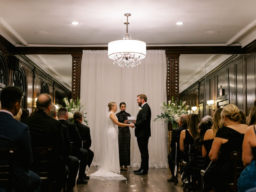 Bride And Groom Holding Hands During Ceremony