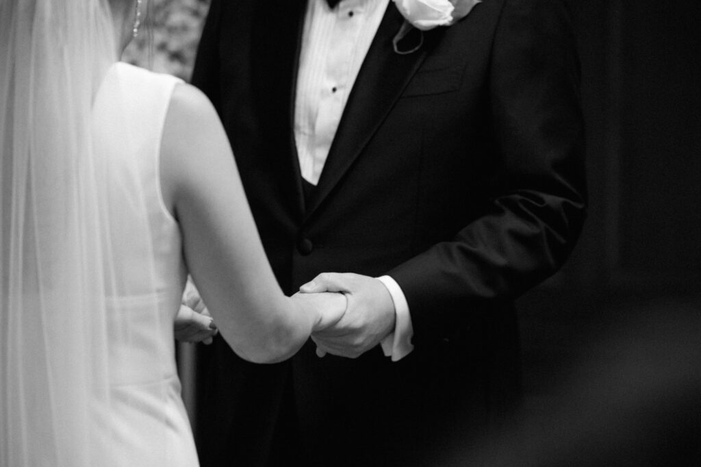 Bride And Groom Holding Hands During Ceremony