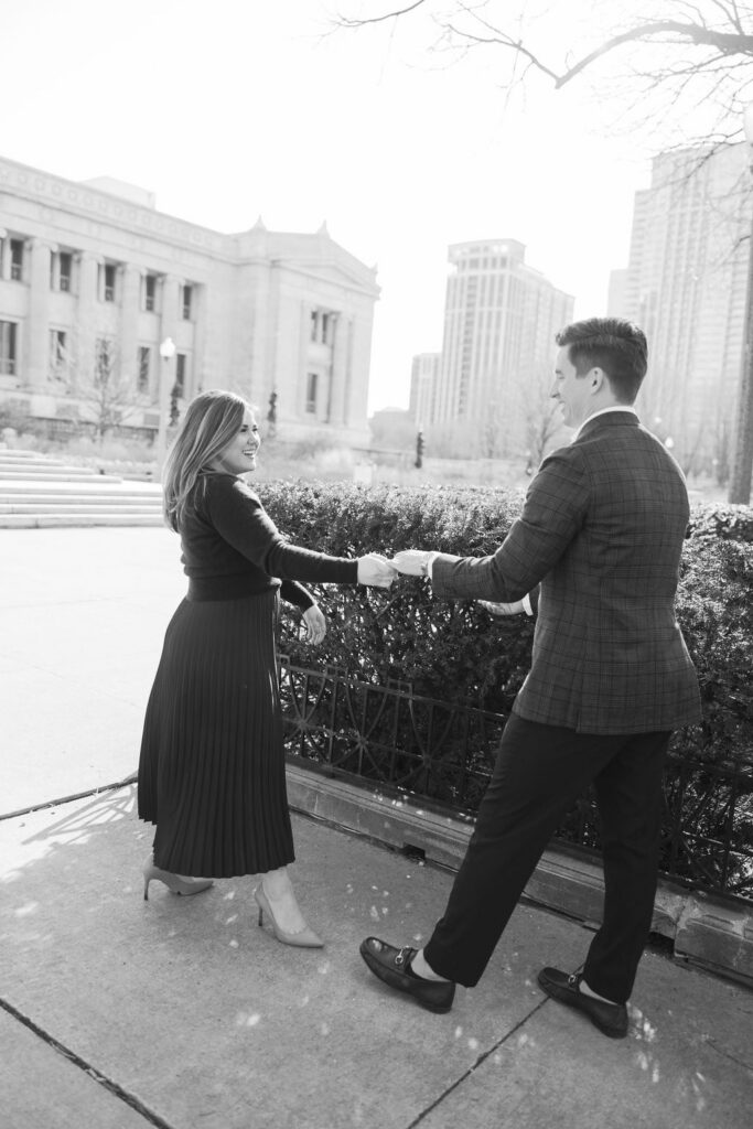 Couple holding hands walking near Museum Campus