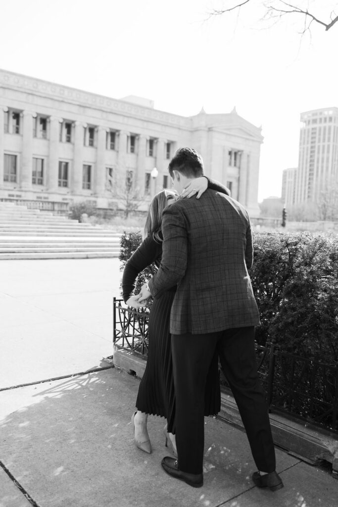 Couple walking together along Chicago sidewalk