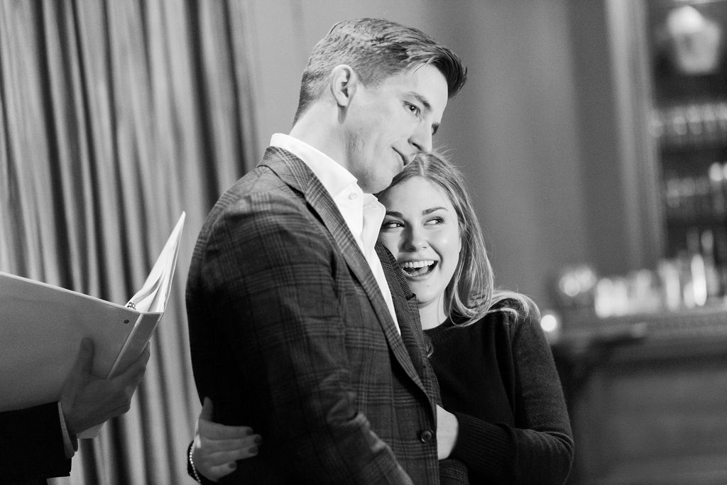 Couple smiling during ceremony officiated by bride’s father