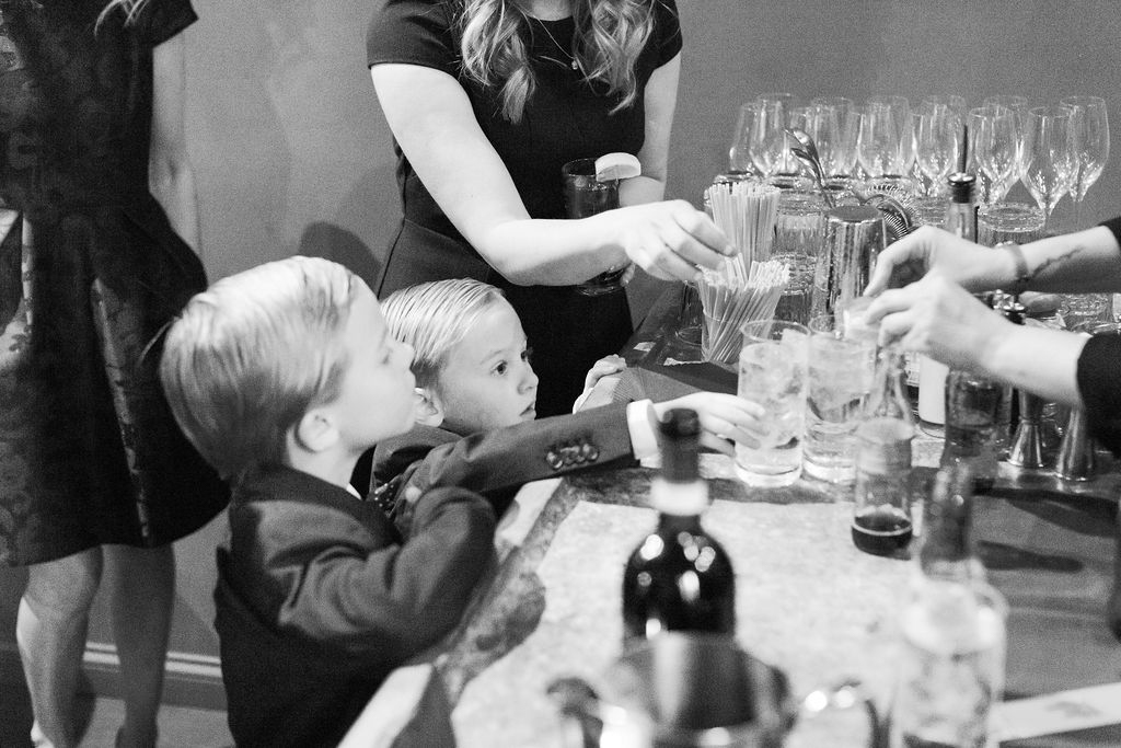 Guests talking and laughing at candlelit dinner table