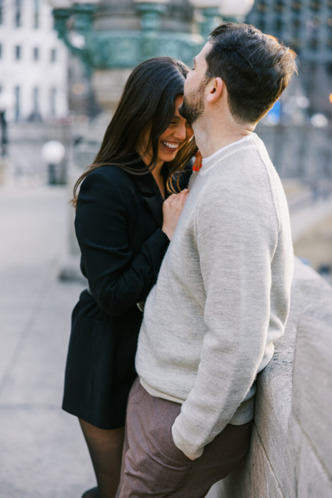 Playful Engagement Photo Couple Laughing By Riverwalk Chicago