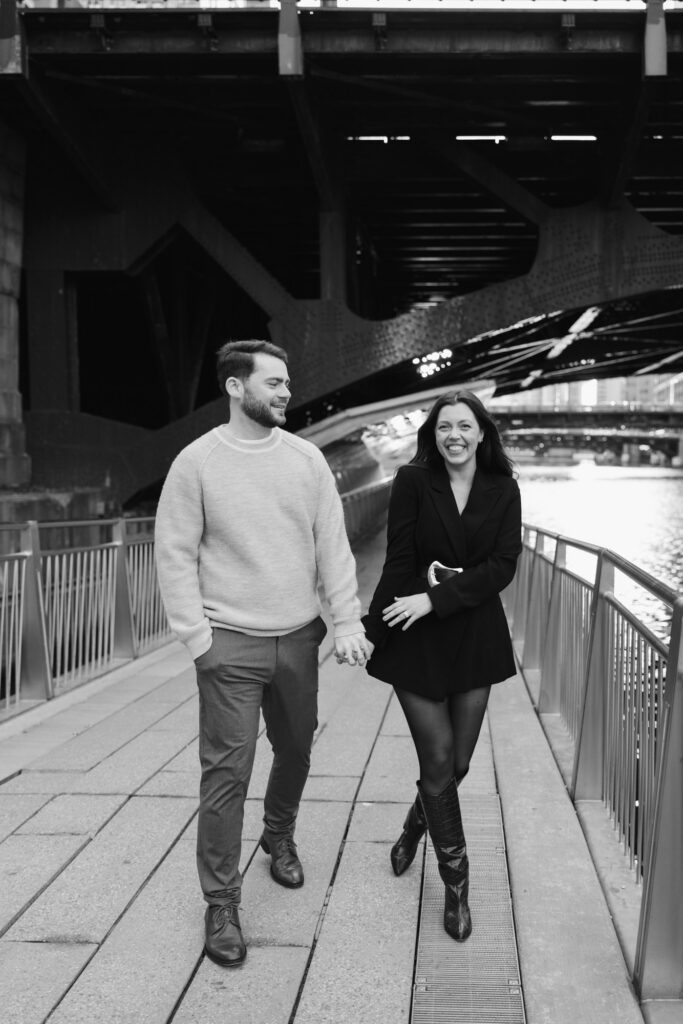 Couple Walking Along Chicago Riverwalk Engagement Session
