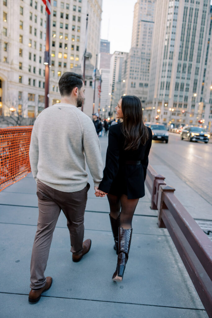Couple Walking Across Chicago Bridge Engagement Session
