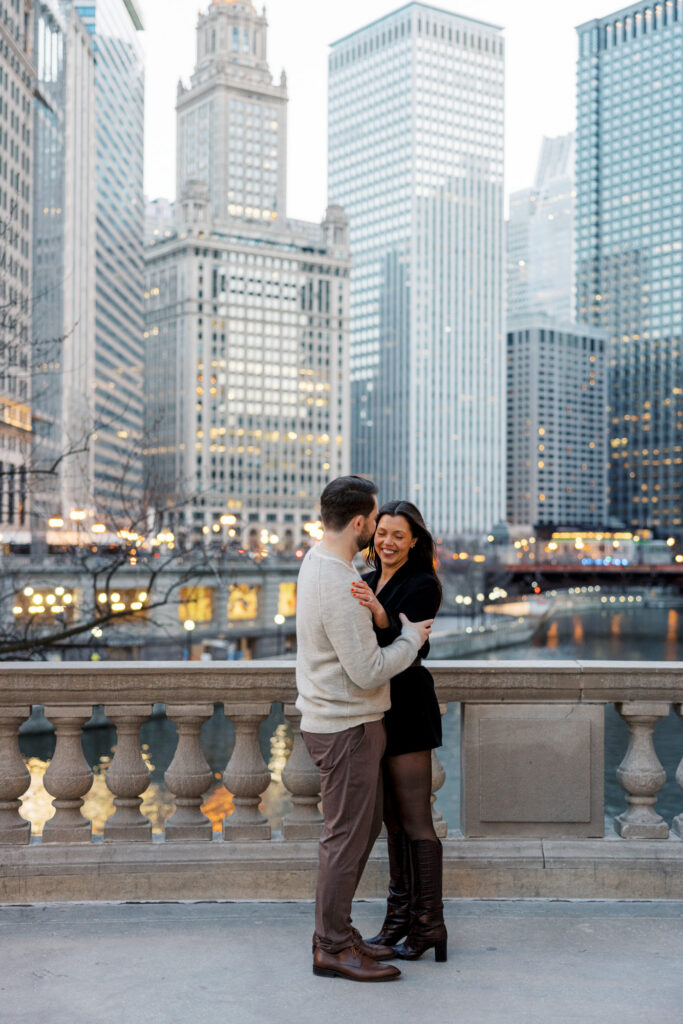 Chicago Skyline Engagement Photo Couple Standing By River