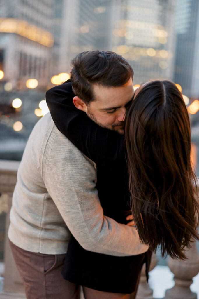 Romantic Engagement Photo Couple Kissing By Riverwalk Chicago

