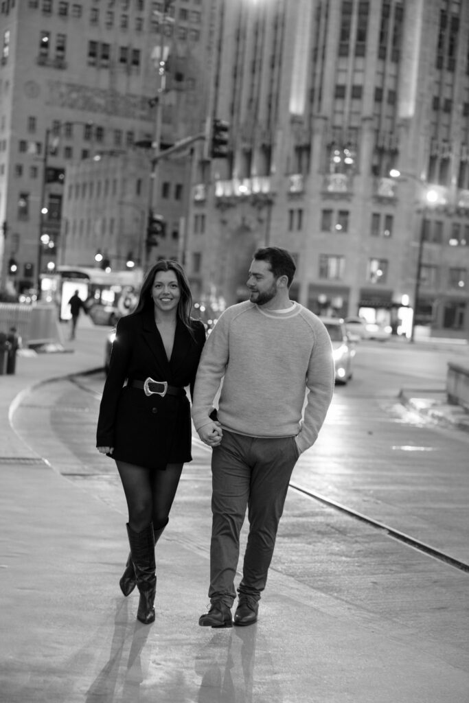Couple Walking Downtown Chicago At Night Engagement Photos
