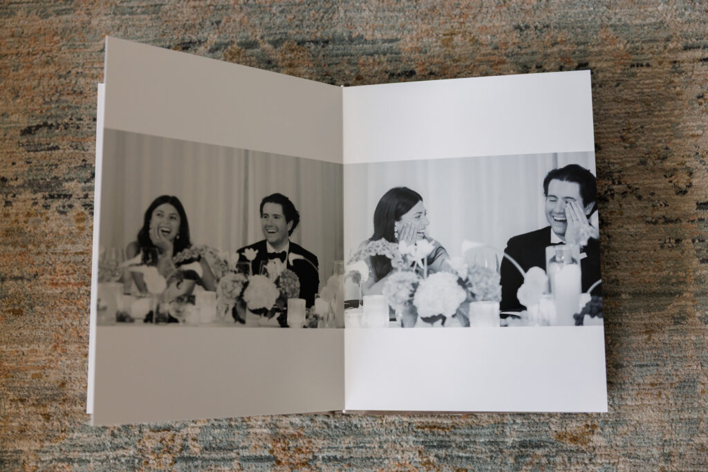 Black and white wedding reception toasts captured across a clean album layout
