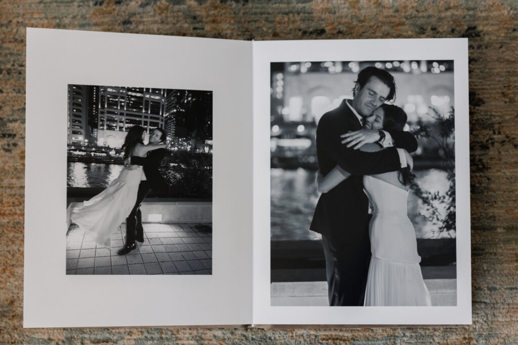 Romantic nighttime wedding portraits in black and white displayed in a lay flat album spread