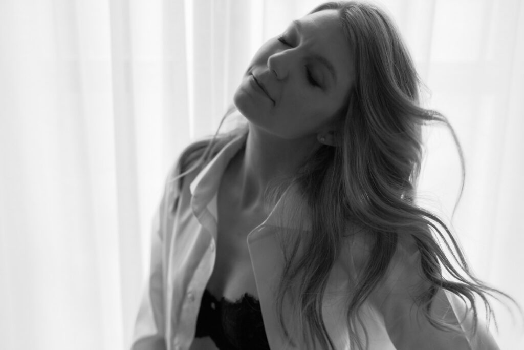 Low light boudoir session with soft window light